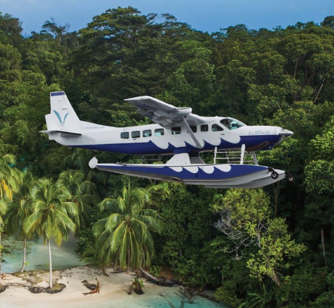 An Elevair plane flying through the rainforest islands of Panama.