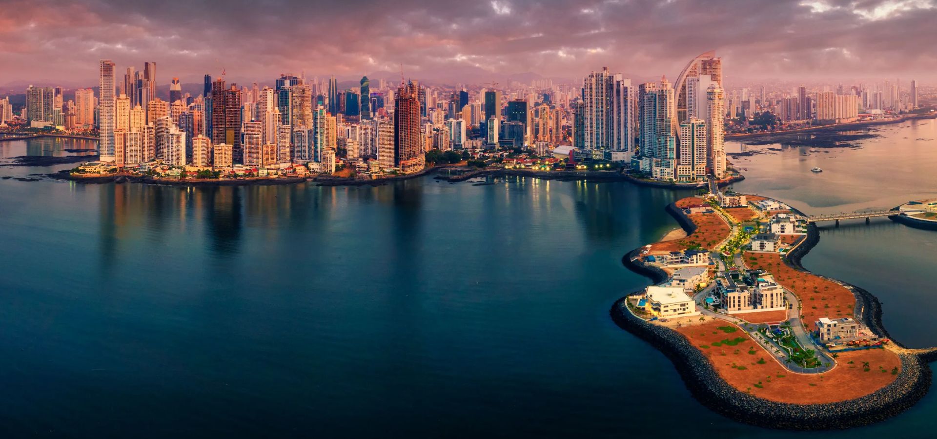 Panama City seen from the air over the Pacific Ocean.