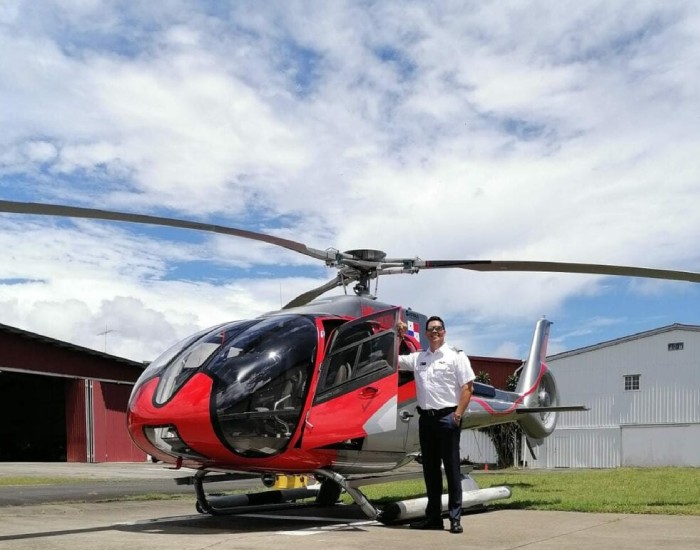 Panama Helicopter Tour Company A red helicopter used for Panamanian tours of the Canal and San Blas.